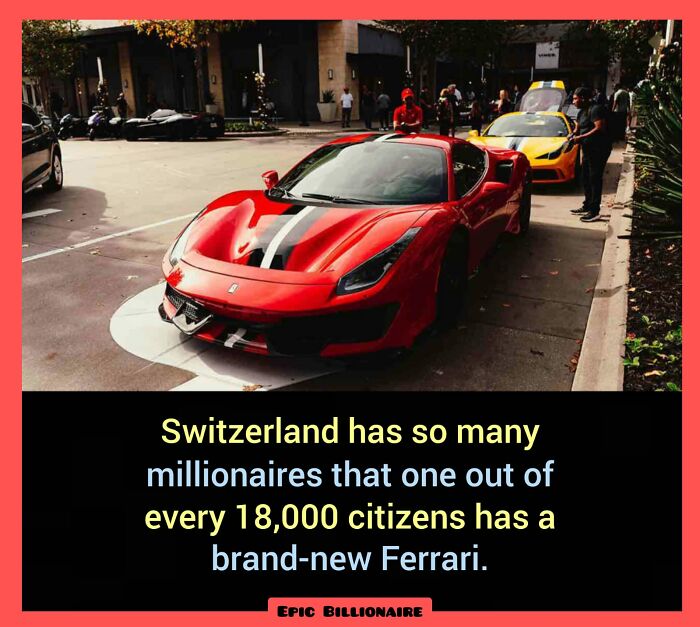 Red Ferrari parked on a street in Switzerland, highlighting a fascinating fact about wealth and luxury cars.