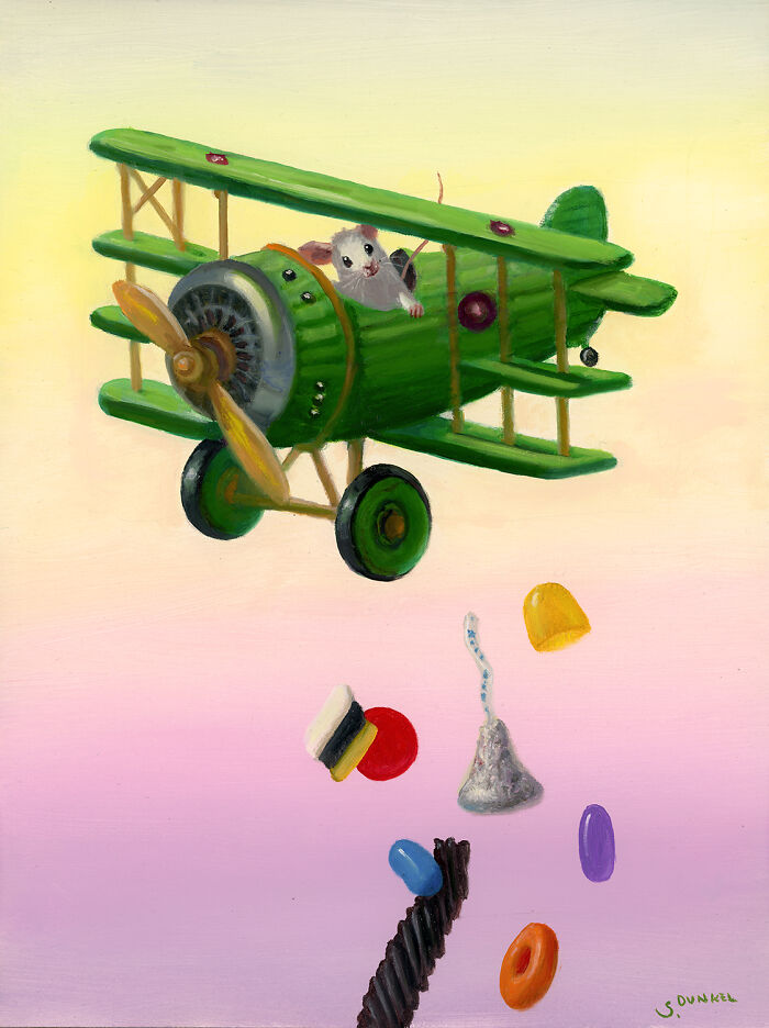 A painted mouse piloting a green plane dropping colorful candies against a pastel sky.