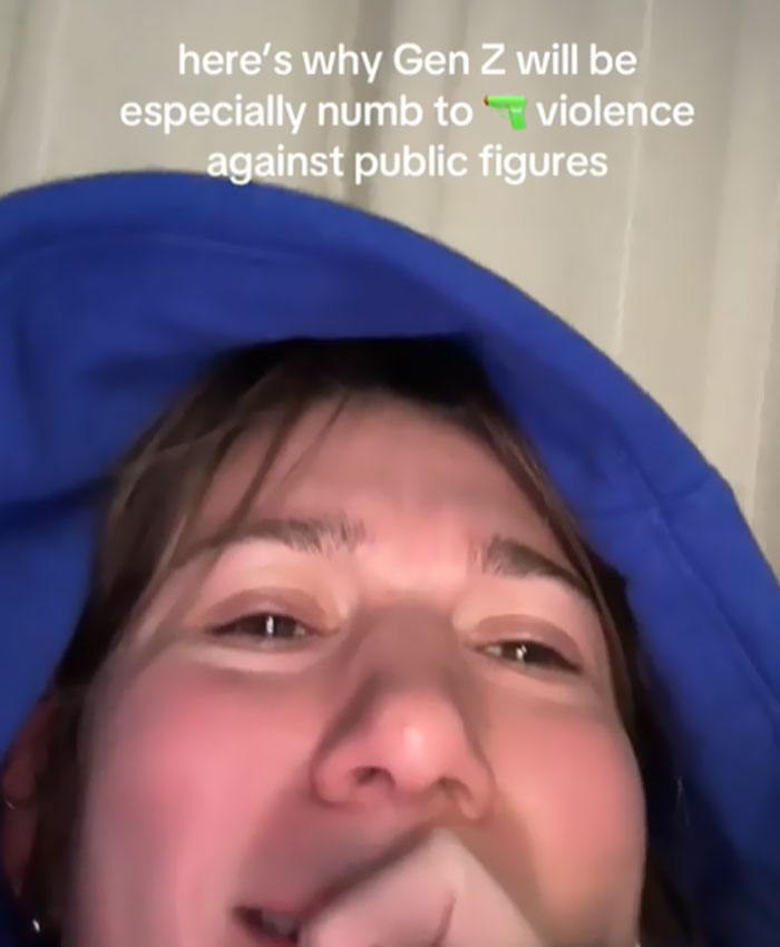 Gen Z individual in a blue hoodie, explaining indifference toward CEOs, highlighting generational sentiments. Gen Z individual in a blue hoodie, explaining indifference toward CEOs, highlighting generational sentiments.