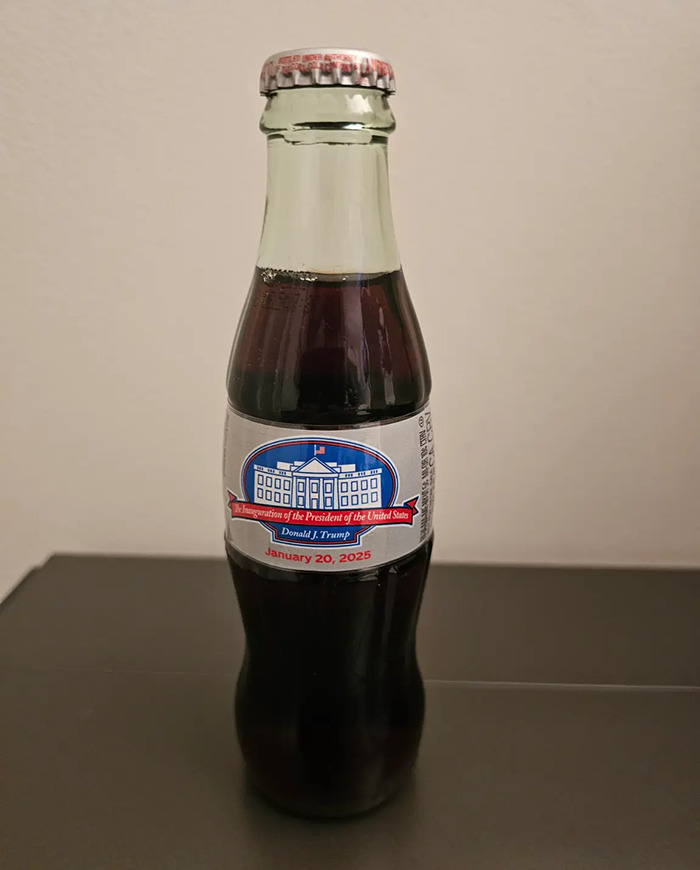 VIP goodie bag item: commemorative bottle from Trump inauguration with White House illustration and date.