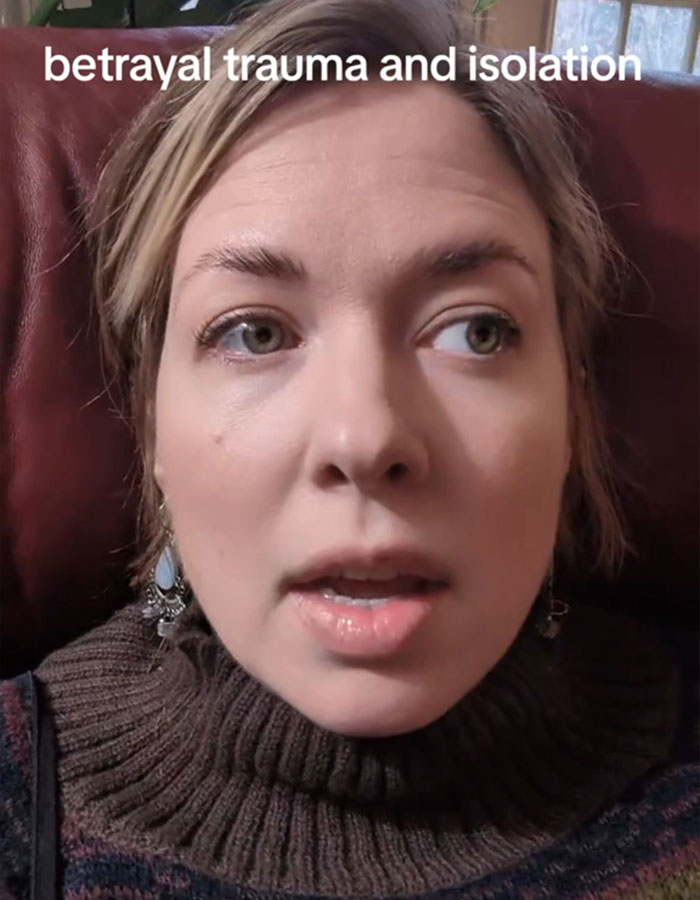 Woman discussing red flags in relationships, expressing hurt and reflection on betrayal trauma, sitting on a couch. Woman discussing red flags in relationships, expressing hurt and reflection on betrayal trauma, sitting on a couch.