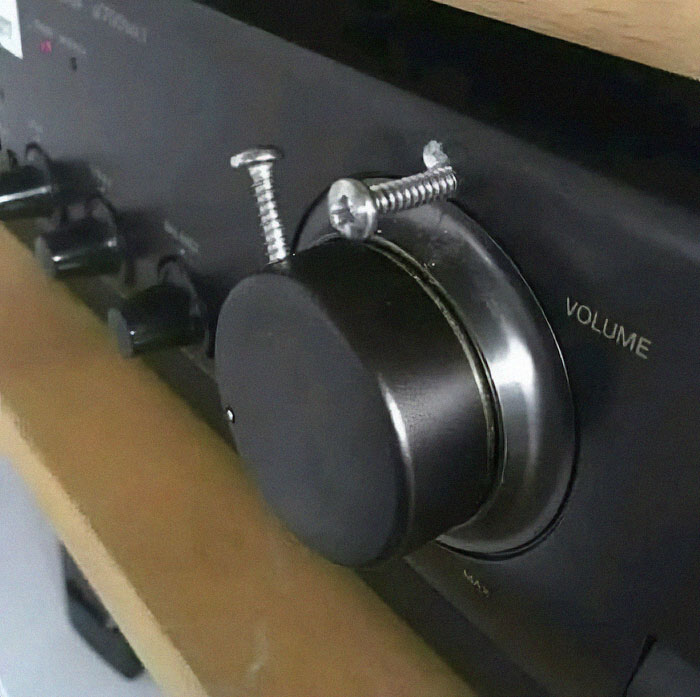 Weird and funny DIY fix with screws on a volume k**b, showing a bizarre solution to a common problem.