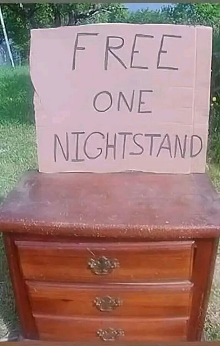 Wooden nightstand with a humorous "Free One Nightstand" sign, showcasing bizarre and funny things people capture.