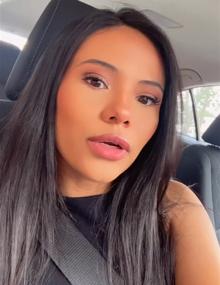 Woman in a car taking over man's dating profile, exploring dating truths.