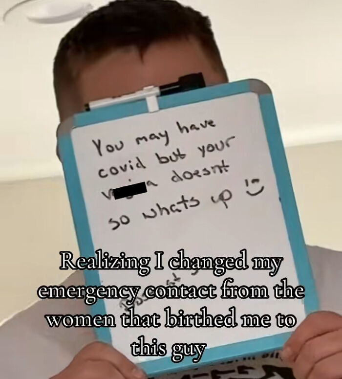 Man holding a board with humorous crisis-related message; text overlay about emergency contact change.