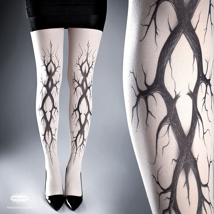 Unique tattoo tights featuring a detailed tree branch design, worn with a black skirt and heels.