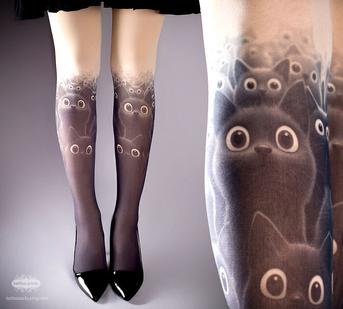 Unique tattoo tights featuring adorable cat design with wide eyes, worn with black shoes, showcasing new collection.