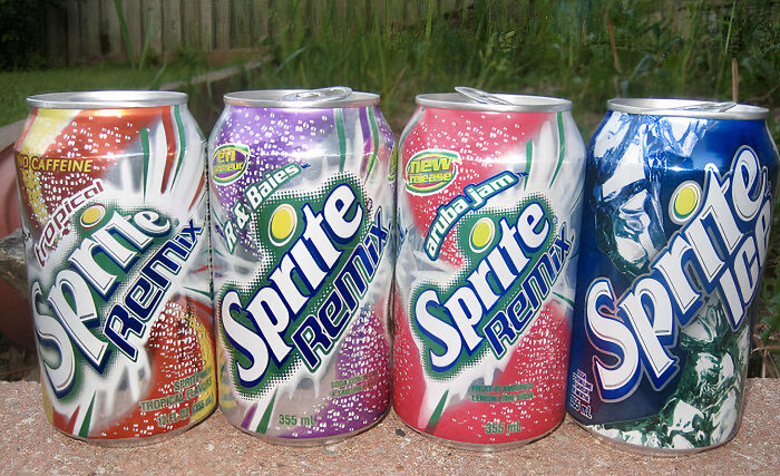 Retro Sprite Remix cans from the 90s and 2000s featuring Tropical, Berryclear, Aruba Jam, and Ice flavors.