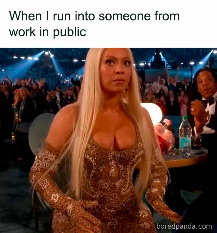 Blonde woman in an embellished dress at the 2025 Grammys, looking surprised amidst a cheering crowd.