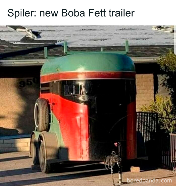 A trailer painted as Boba Fett's helmet, showcasing dad humor in a driveway.