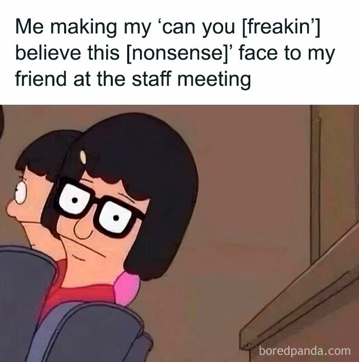 Character making a humorous face at a staff meeting, captured in a relatable meme style.