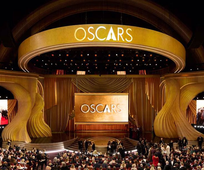 Oscar nominees 2025 event, golden stage design, large audience gathered in a grand theater setting. Oscar nominees 2025 event, golden stage design, large audience gathered in a grand theater setting.