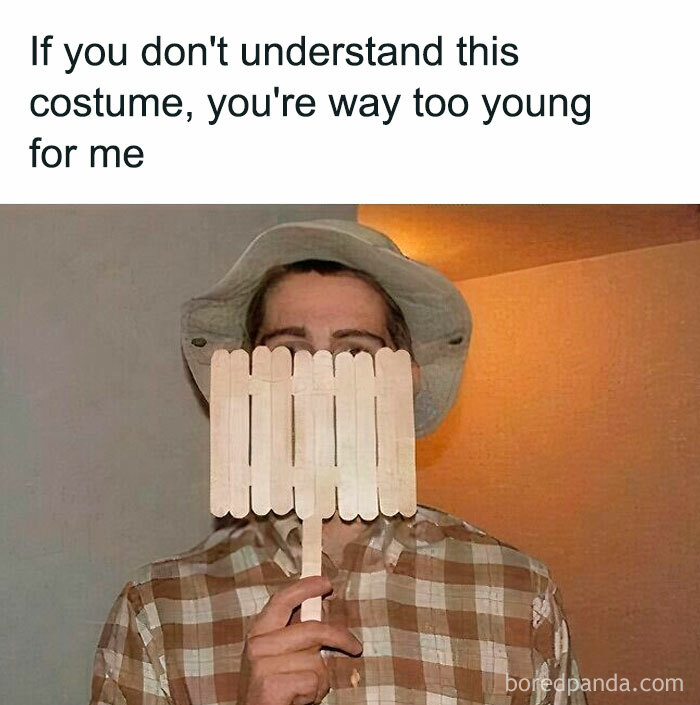 Person in a checkered shirt and hat holding popsicle sticks resembling '90s character humor.