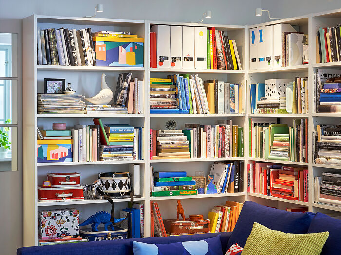 Bookshelf with colorful books and stylish decor, showcasing beautifully designed and durable items for longevity.