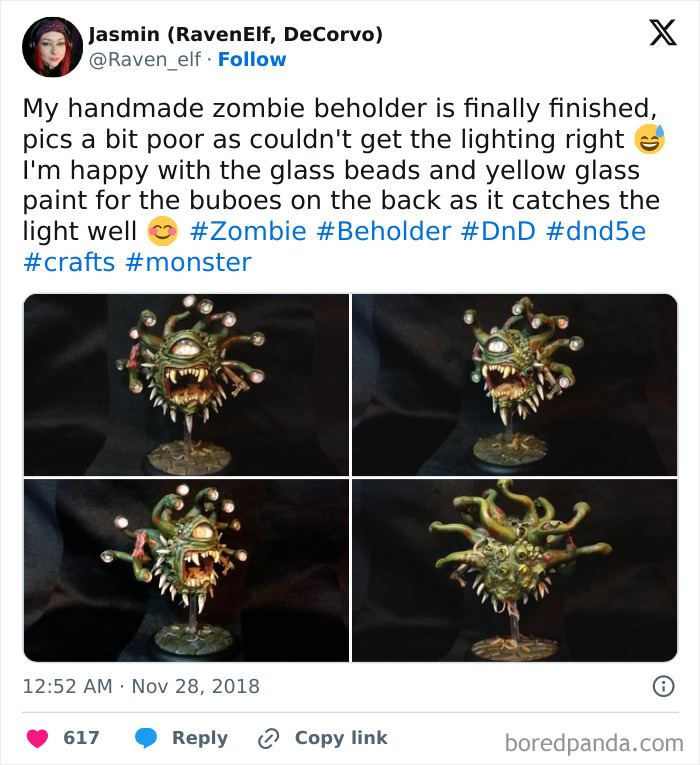 Handmade creepy craft of a zombie beholder with glass bead eyes and textured skin on display.