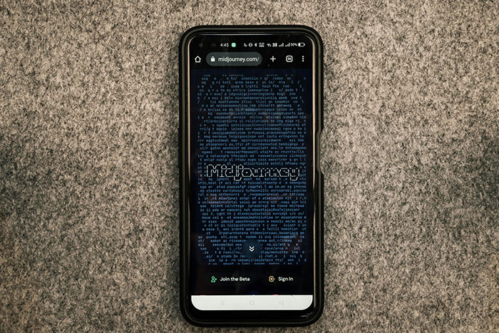 Smartphone displaying a website for safe side hustle ideas on a gray textured surface.