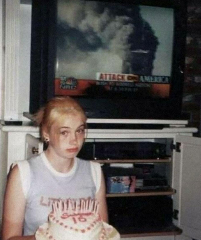 Girl with a birthday cake, TV displaying news in the background, creating a weird context.
