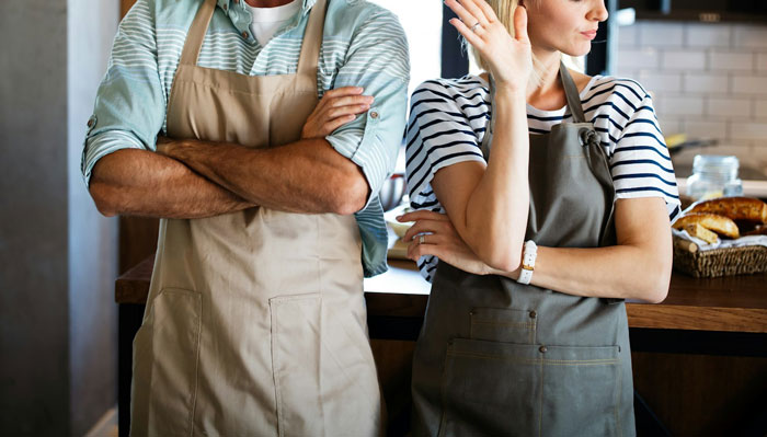 Teen crosses arms in annoyance while woman gestures, connected to expensive skincare issue.