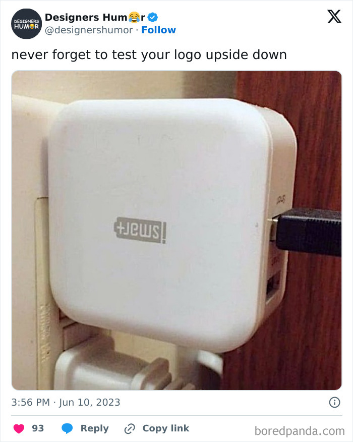 Upside-down logo on a wall charger highlighting a funny design fail.