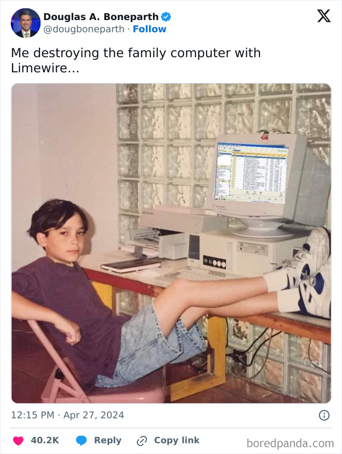 Child using Limewire on a vintage 2000s computer, feet on desk, embodying 2000s nostalgia.