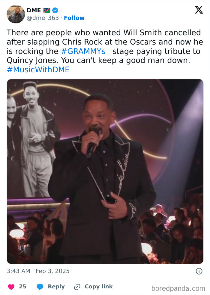 Man on stage at the 2025 Grammys holding a microphone, with people seated in the audience.