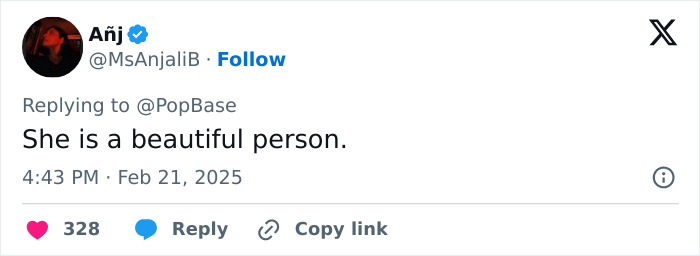 Tweet by user MsAnjaliB replying to PopBase, saying "She is a beautiful person," with a date and interaction icons.
