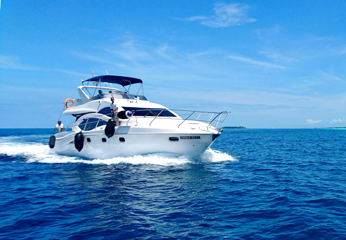 Luxury yacht cruising on the ocean under a clear blue sky, showcasing rich people's lifestyle.