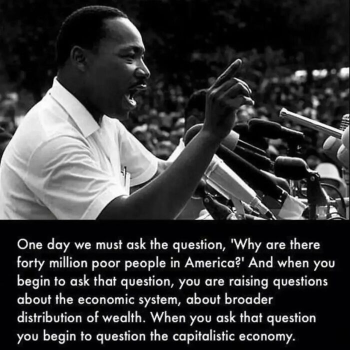 A speaker passionately addresses a crowd, discussing issues related to capitalism and economic inequality.