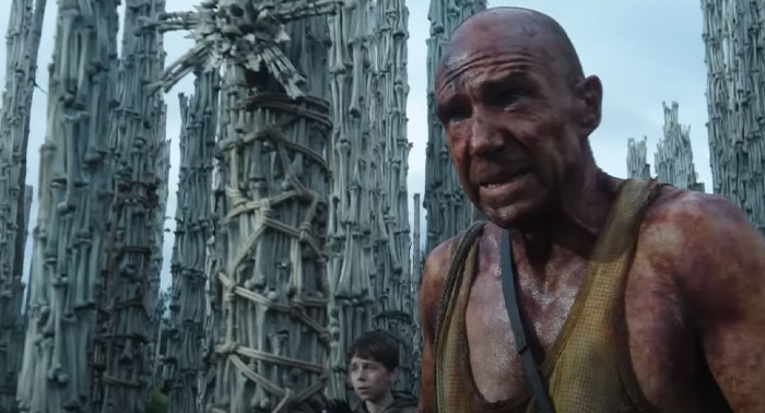 Scene from 28 Years Later with a man looking distressed amidst dystopian surroundings. Scene from 28 Years Later with a man looking distressed amidst dystopian surroundings.
