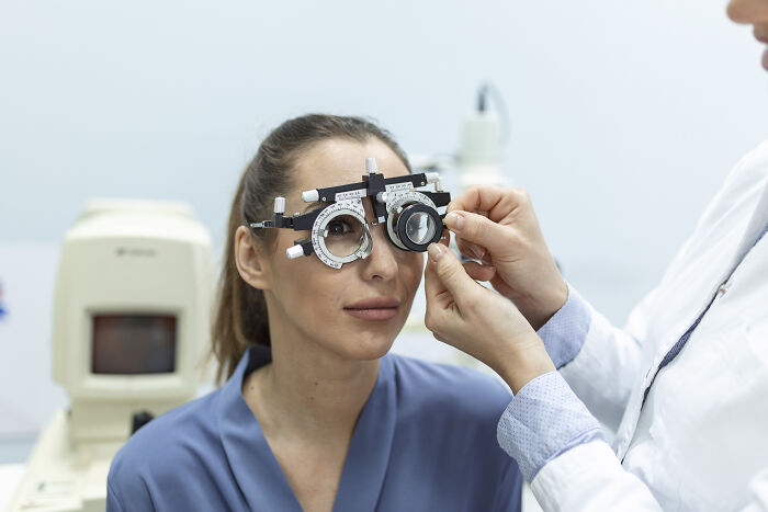 Person undergoing rare cosmetic eye procedure in a clinical setting.