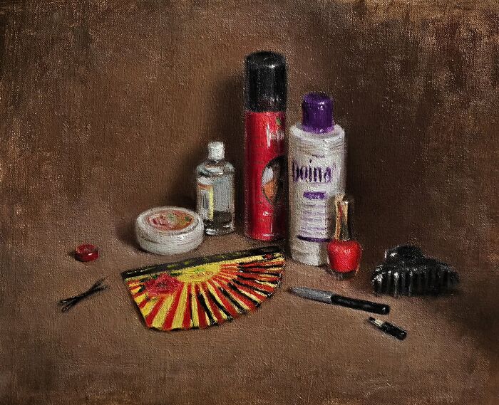 Oil painting of nostalgic Eastern European objects including bottles, a fan, and a comb on a brown background.