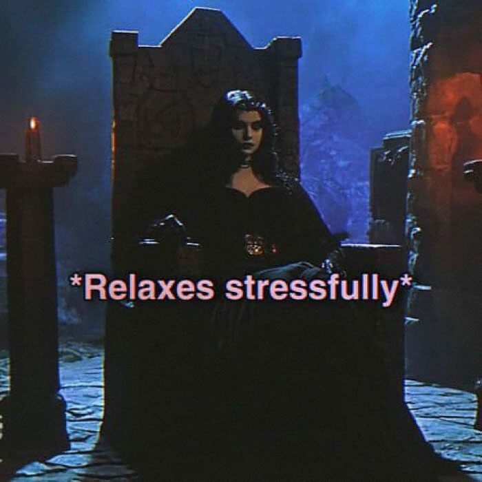 A person sits in a dark, medieval setting with the text “Relaxes stressfully,” highlighting mental health memes.