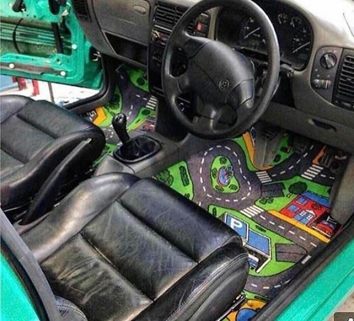 Unique car interior with colorful play mat flooring showcases interesting designs.