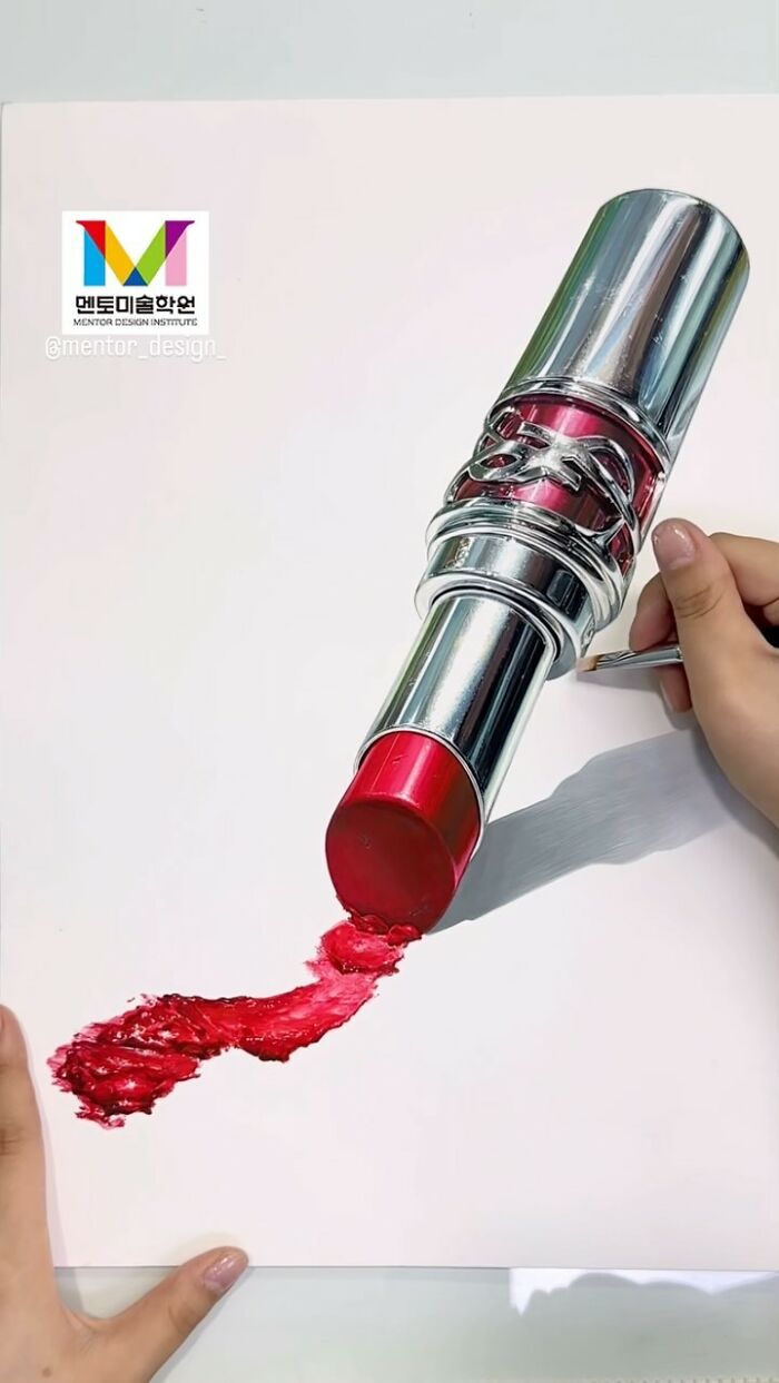 Hyperrealistic painting of a red lipstick on a white canvas, with artist's hand holding a pencil nearby.