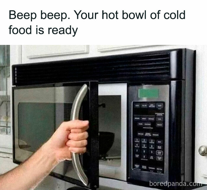 Hand opening a microwave, humorously captioned about a hot bowl of cold food, perfect for those who love to cook.