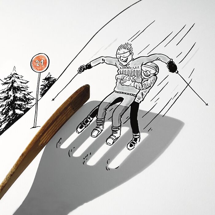 Artist transforms object shadow into illustration of skiers, creating a playful and imaginative scene.
