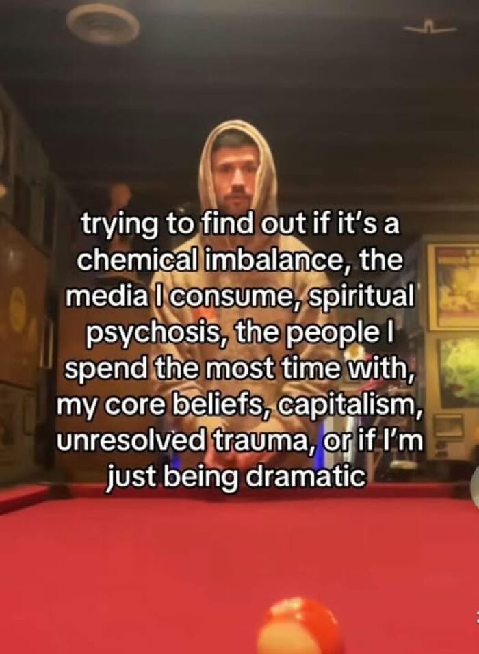 Man in hoodie standing by a pool table with text overlay about mental health struggles, reflecting on various influences.