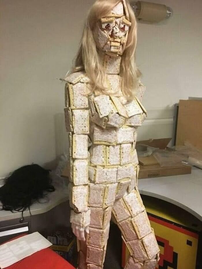 A mannequin covered in toaster pastries, creating a weird image worth seeing for its unusual and creative design.