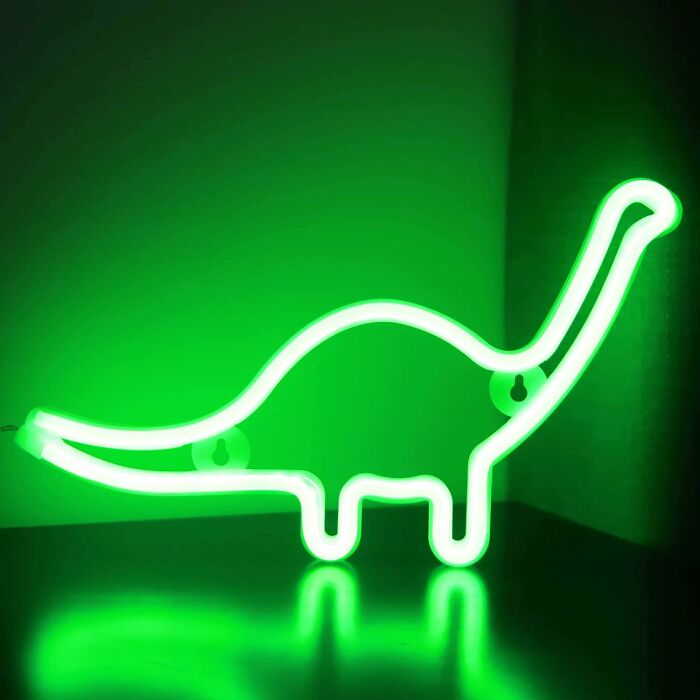 Glowing green dinosaur-shaped neon light that brings joy.