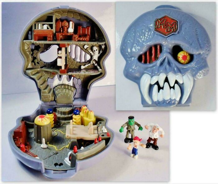 90s toy skull-shaped playset open with figurines of monsters included.