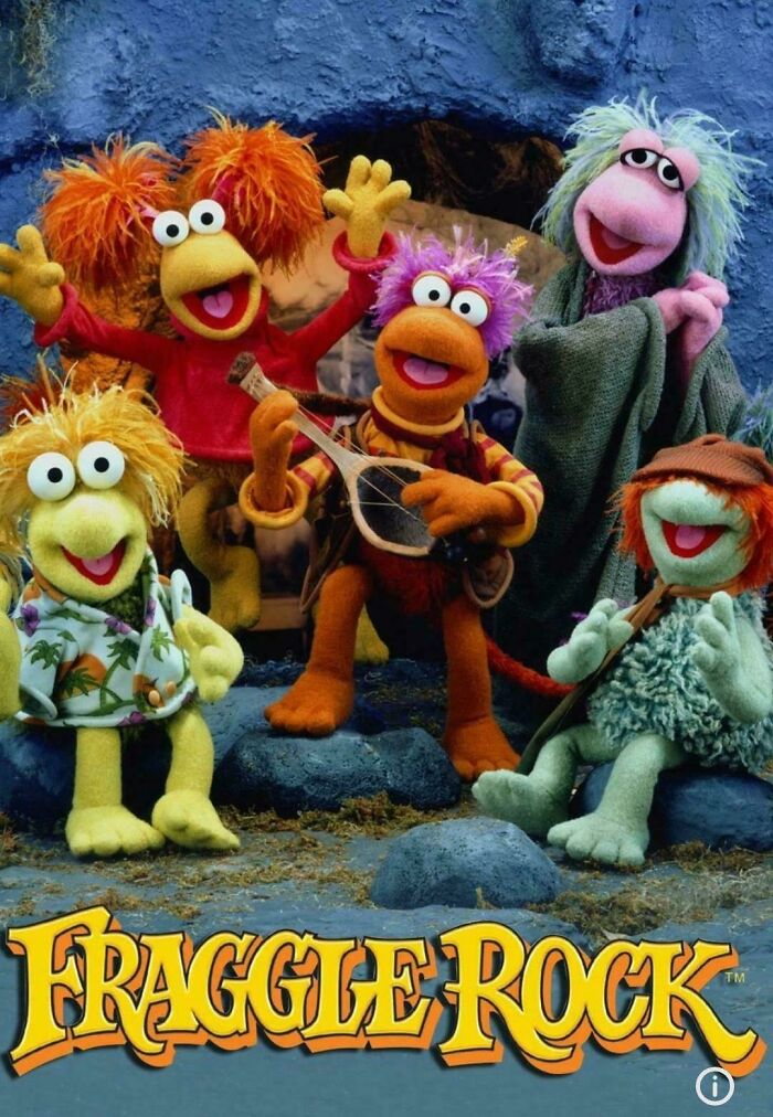 Fraggle Rock characters posing together in a colorful setting, evoking nostalgic photos from classic children's TV shows.