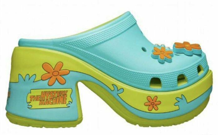 Chunky platform clog shoes with Scooby-Doo Mystery Machine design, showcasing awful taste but great e*******n in footwear.