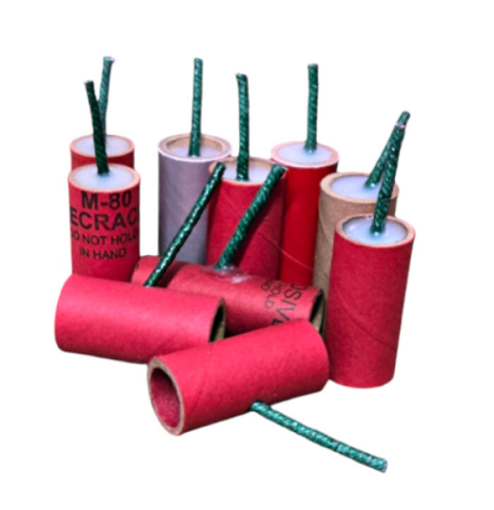 Colorful firecrackers with green fuses, reminiscent of nostalgic childhood celebrations.