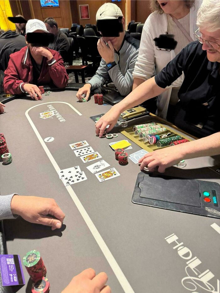 Poker players at a casino table captured in a wild coincidence moment with matching playing cards and chips in play.
