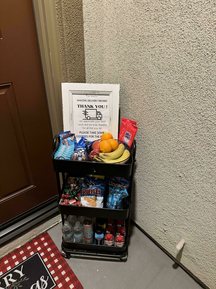 Snacks and drinks cart for Instacart shoppers with a thank you note in a hallway setting.