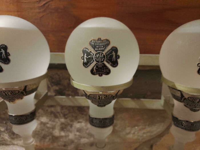 Vintage fire extinguisher bulb with labels, showcasing cool-old-things.