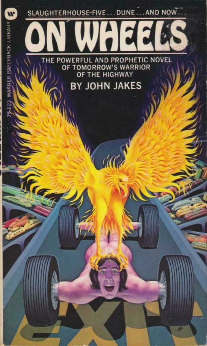 Terrible book cover featuring a phoenix over a man with wheel arms and a shocked face on a track.