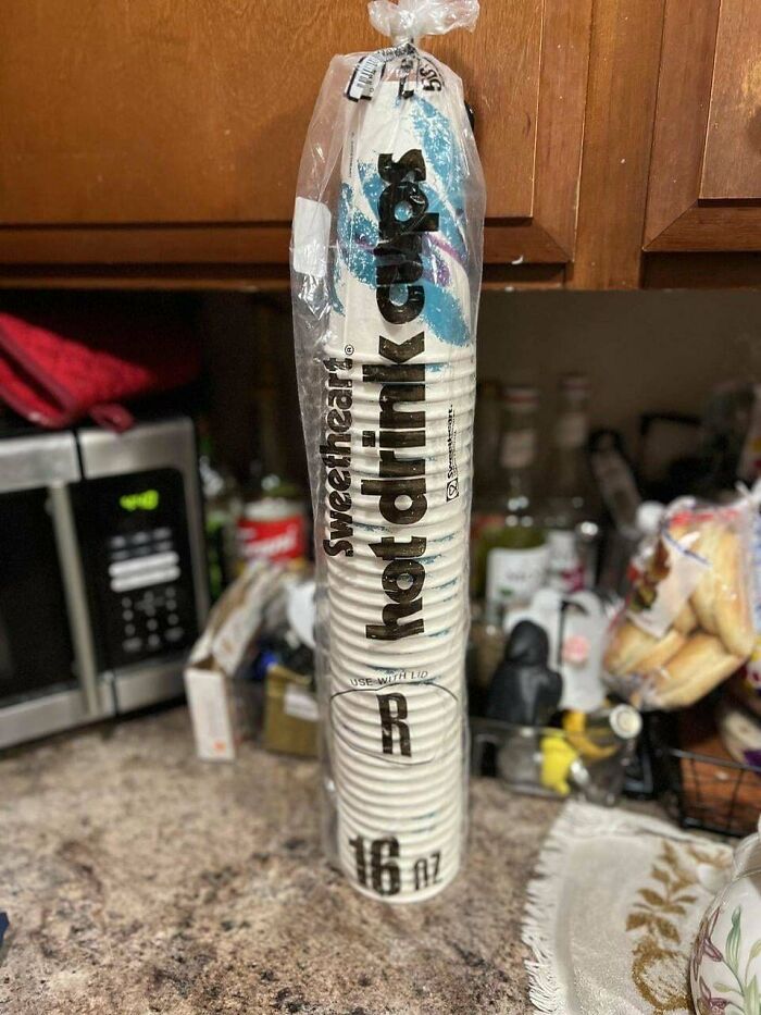 Pack of 90s hot drink cups on a kitchen counter.