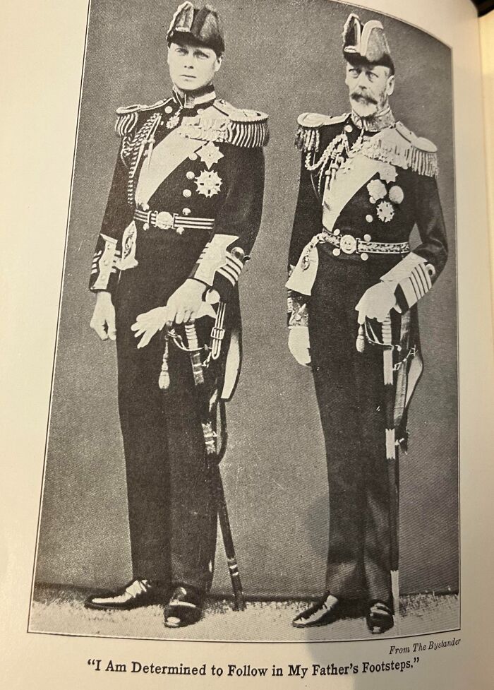 Two men in ceremonial uniforms, representing future predictions aged bad, with caption about following in father’s footsteps.