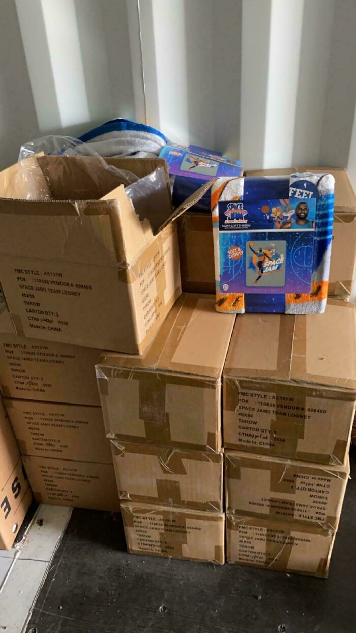 Boxes of Space Jam merchandise stacked neatly in a corner, revealing mildly interesting surprises.